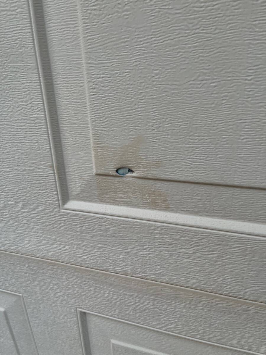 A bullet hole is seen in a home in the 3400 block of Bella Lante Avenue on Monday, April 24, 20 ...