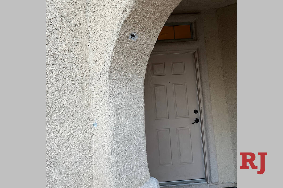 A bullet hole is seen in the doorway of a home in the 3400 block of Bella Lante Avenue on Monda ...