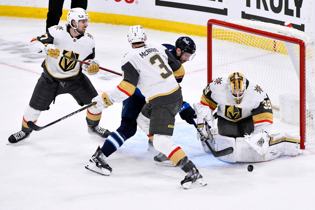 Vegas Golden Knights' goaltender Laurent Brossoit (39) makes a save against Winnipeg Jets' Dyla ...