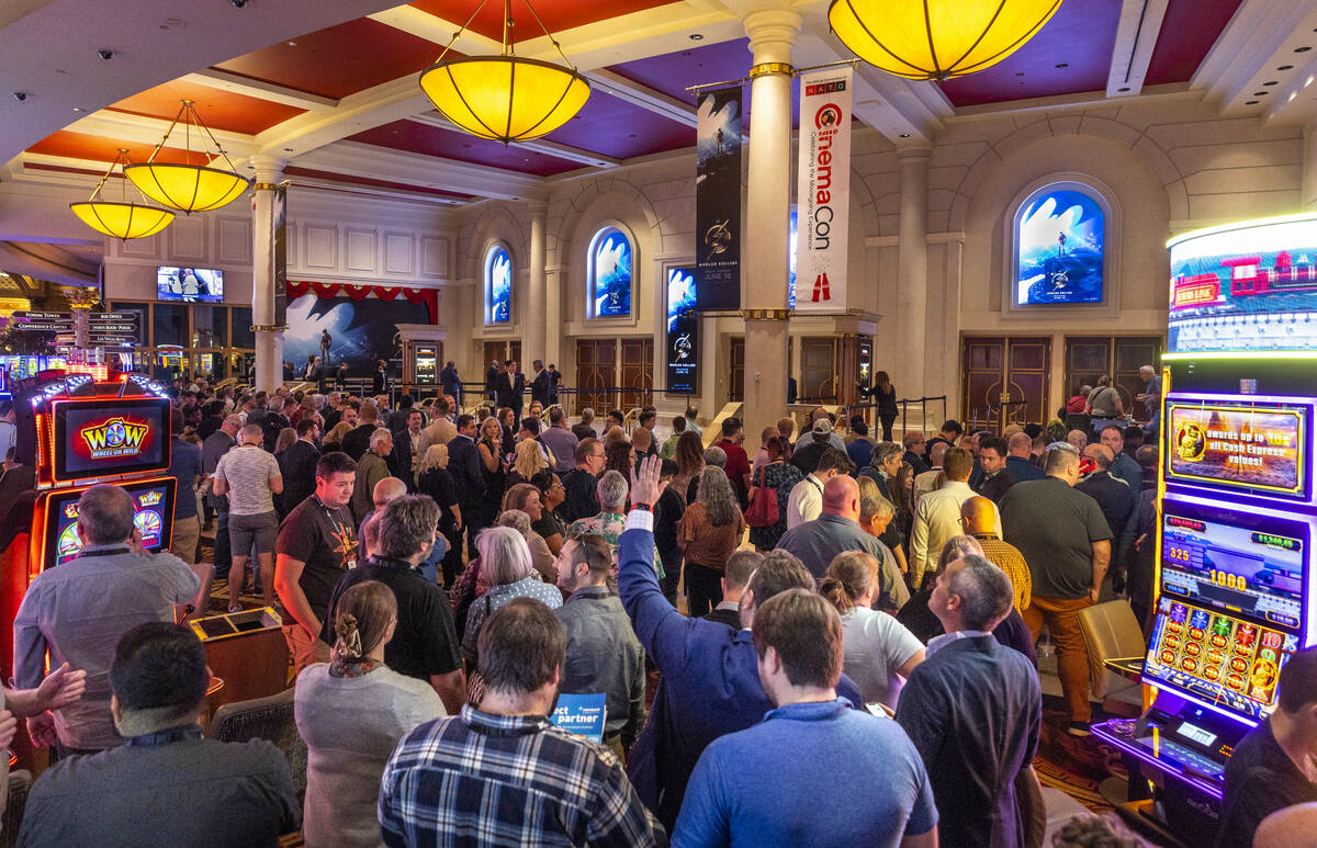 Attendees line up for a screening of The Flash during CinemaCon at Caesars on Tuesday, April 25 ...