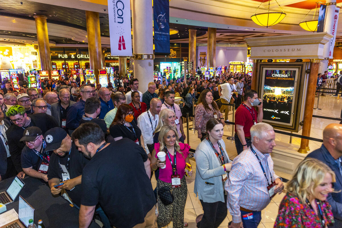 Attendees stream in for a screening of The Flash during CinemaCon at Caesars on Tuesday, April ...