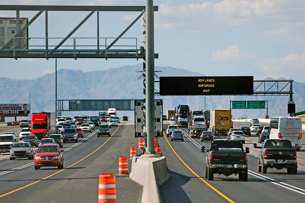 The high-occupancy vehicle lanes are largely empty in both directions on Interstate 15 near the ...