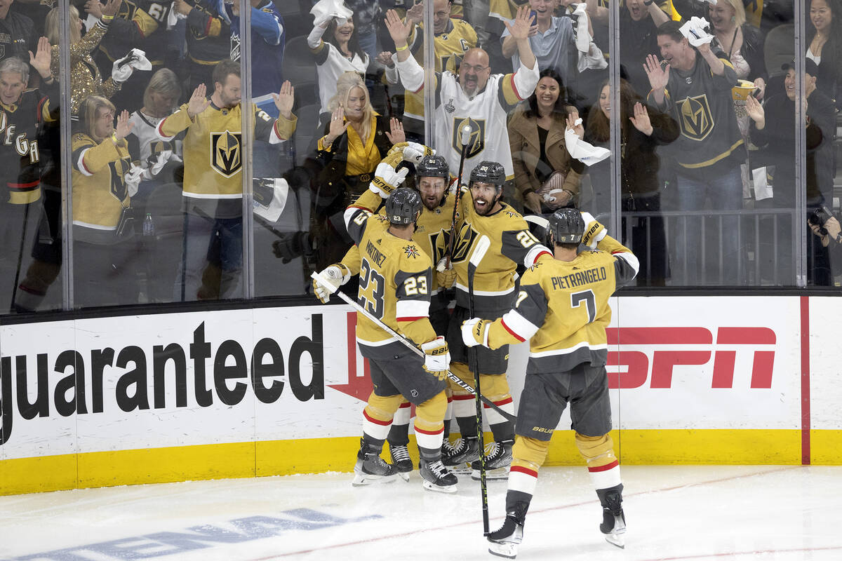 The Golden Knights celebrate after center Chandler Stephenson (20) scored during the first peri ...