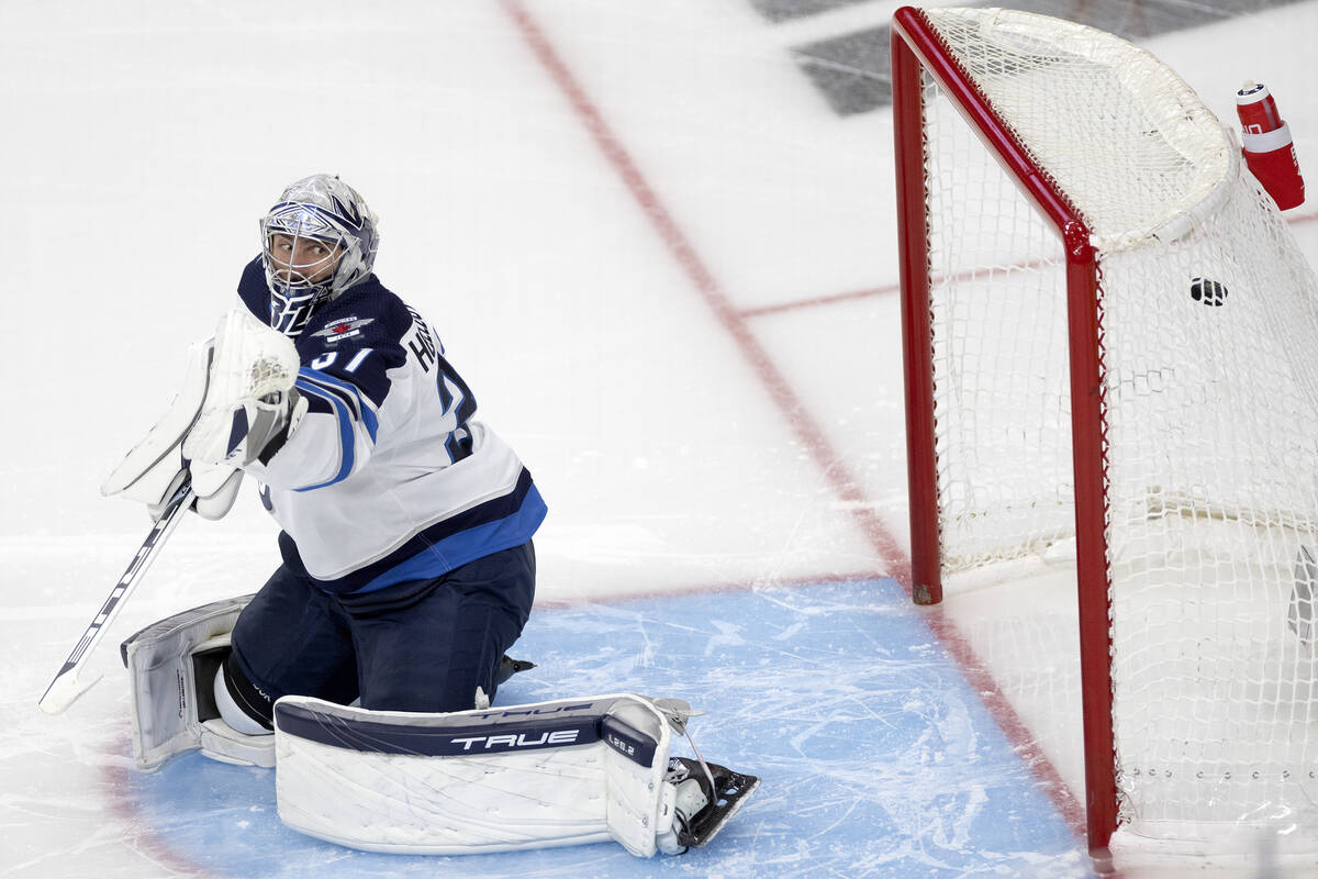 Winnipeg Jets goaltender Connor Hellebuyck (37) misses the save on a goal by Golden Knights rig ...