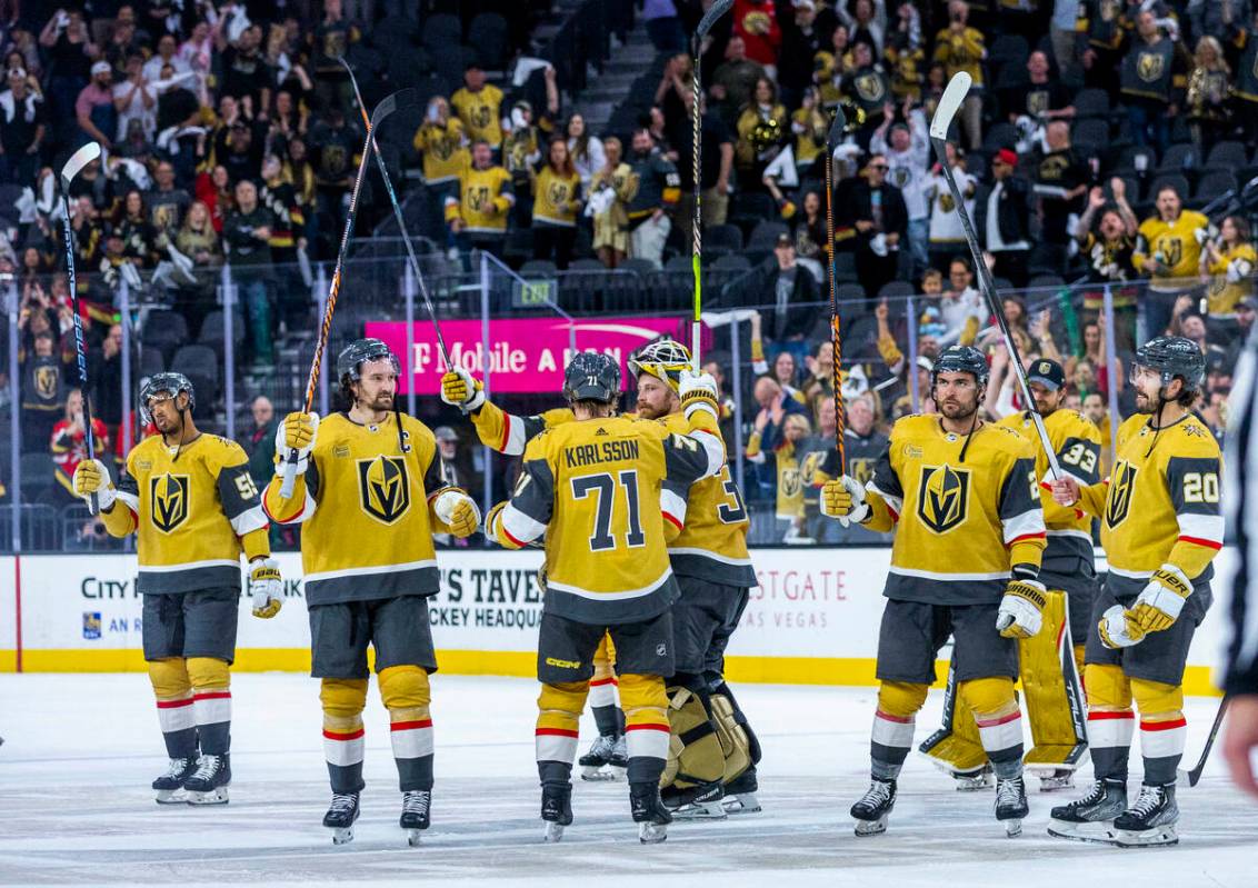 Golden Knights players celebrate with fans after defeating the Winnipeg Jets following the thir ...