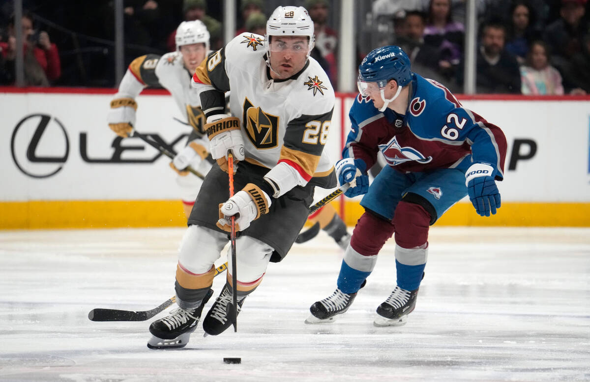 Golden Knights left wing William Carrier (28) drives down the ice with the puck as Colorado Ava ...