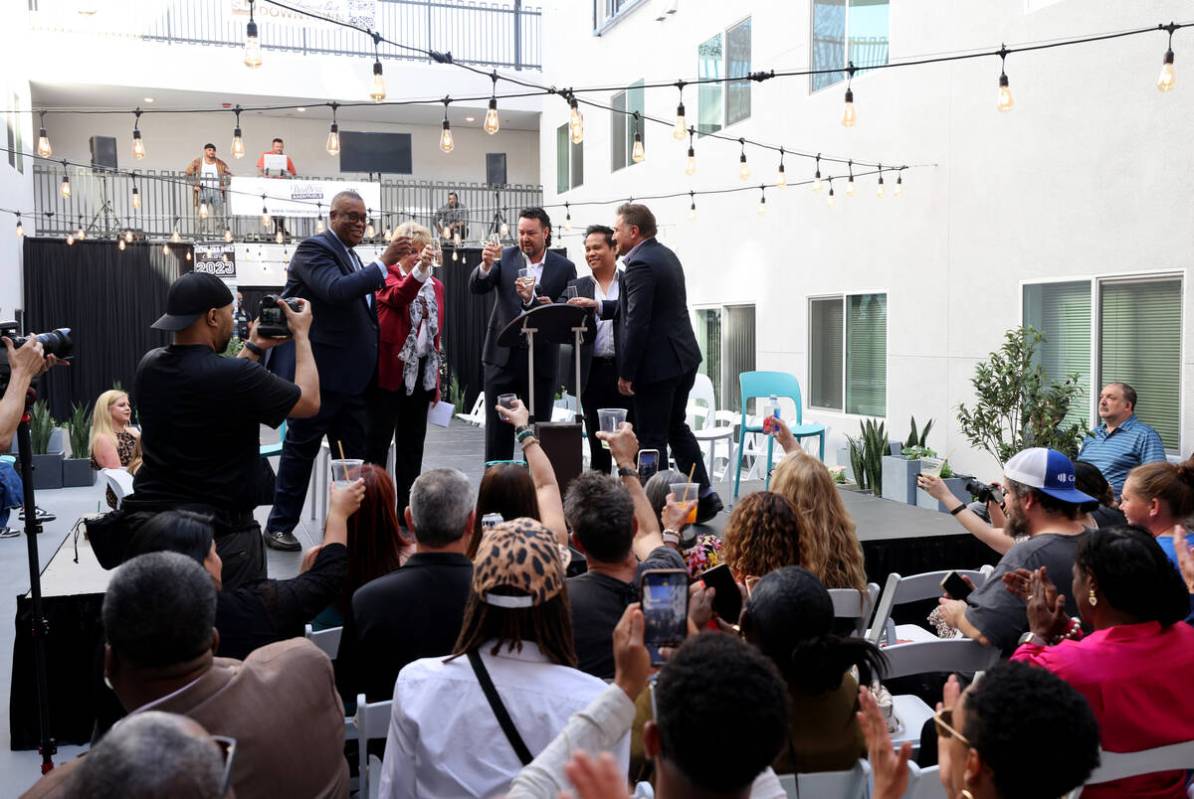 Developer Sam Cherry, center, toasts with, from left, Las Vegas City Councilman Cedric Crear, M ...