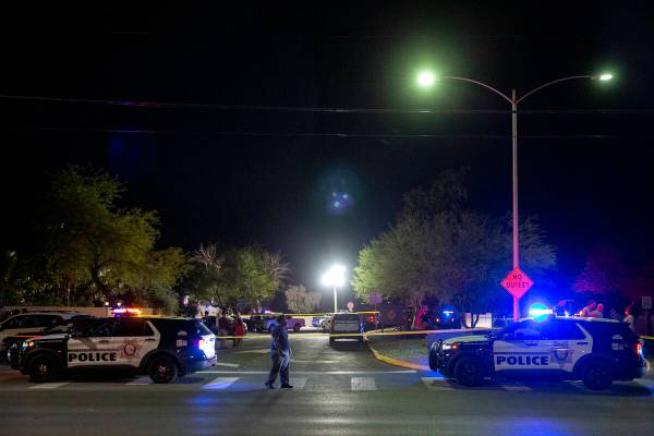 Metropolitan police investigate a homicide in the 1100 block of Comstock Drive on Wednesday, Ap ...