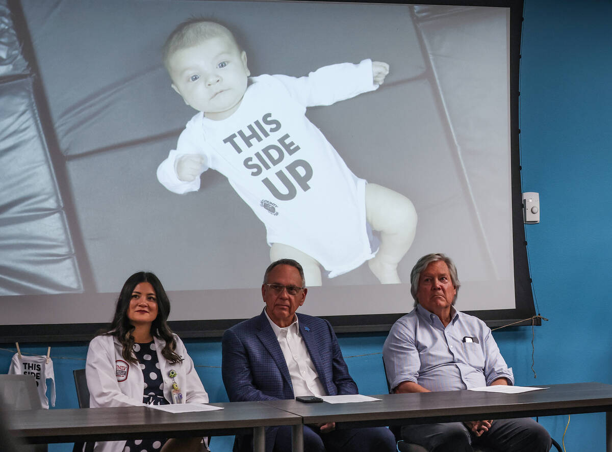 UNLV Pediatric Dr. Jessica Tay, from left, Clark County Commissioner Jim Gibson, and Clark Cou ...