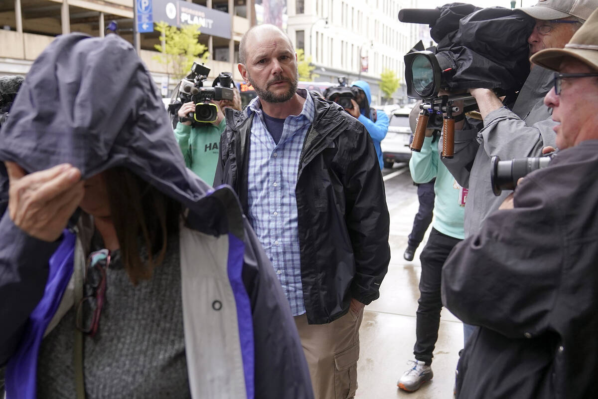 Members of Jack Teixeira's family, left and center, arrive at federal court, Thursday, April 27 ...