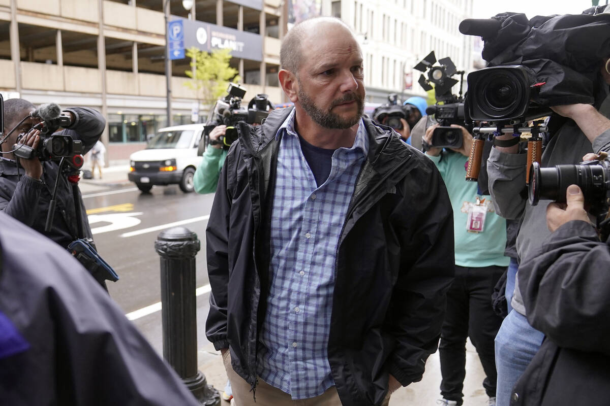 A member of Jack Teixeira's family, center, arrives at federal court, Thursday, April 27, 2023, ...