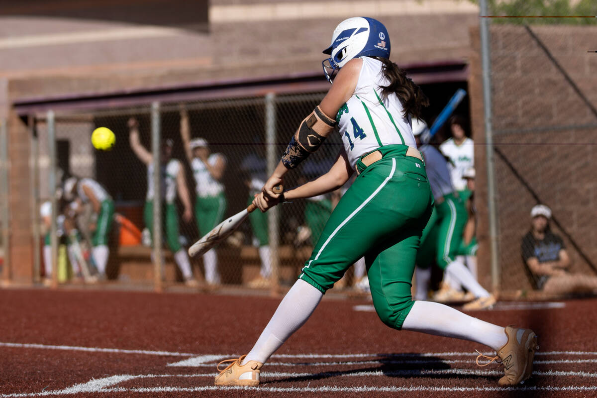 Green Valley catcher Rustie Riley bats against Faith Lutheran during a high school softball gam ...