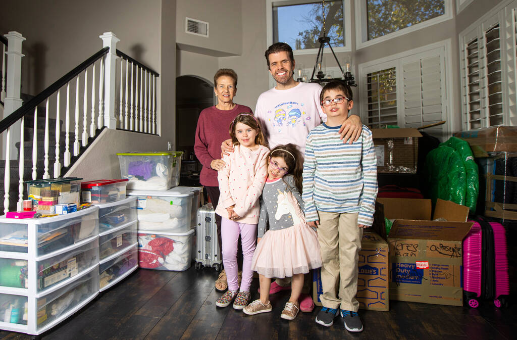 Perez Hilton, center, poses with, from left, his mom,Teresita Lavandeira, and kids, Mia, 7, May ...