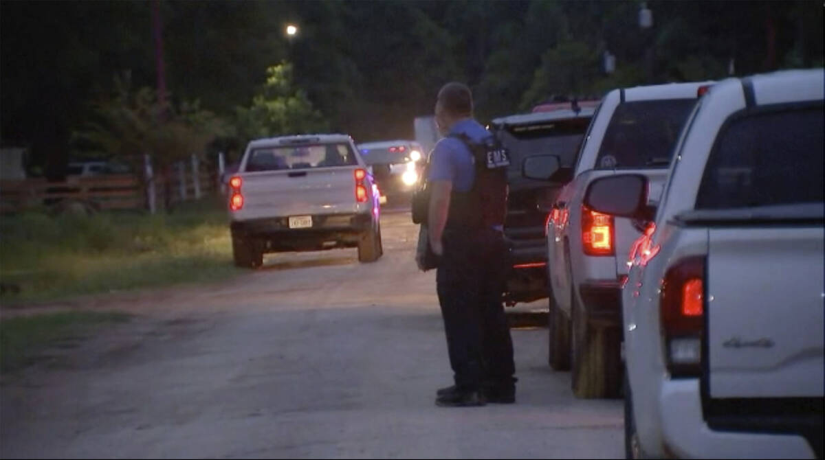 Police respond to the scene of a shooting early Saturday, April 29, 2023 in Cleveland, Texas. ...