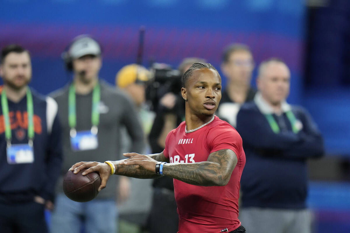 UCLA quarterback Dorian Thompson-Robinson runs a drill at the NFL football scouting combine in ...