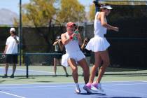 UNLV women’s tennis player Molly Helgesson sprays teammate Cindy Hu with a water bottle follo ...