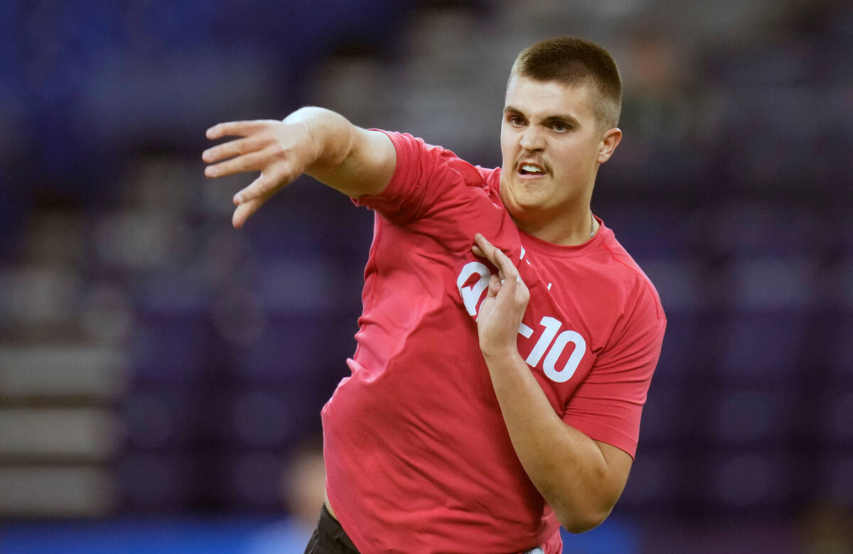 Purdue quarterback Aidan O'Connell runs a drill at the NFL football scouting combine in Indiana ...