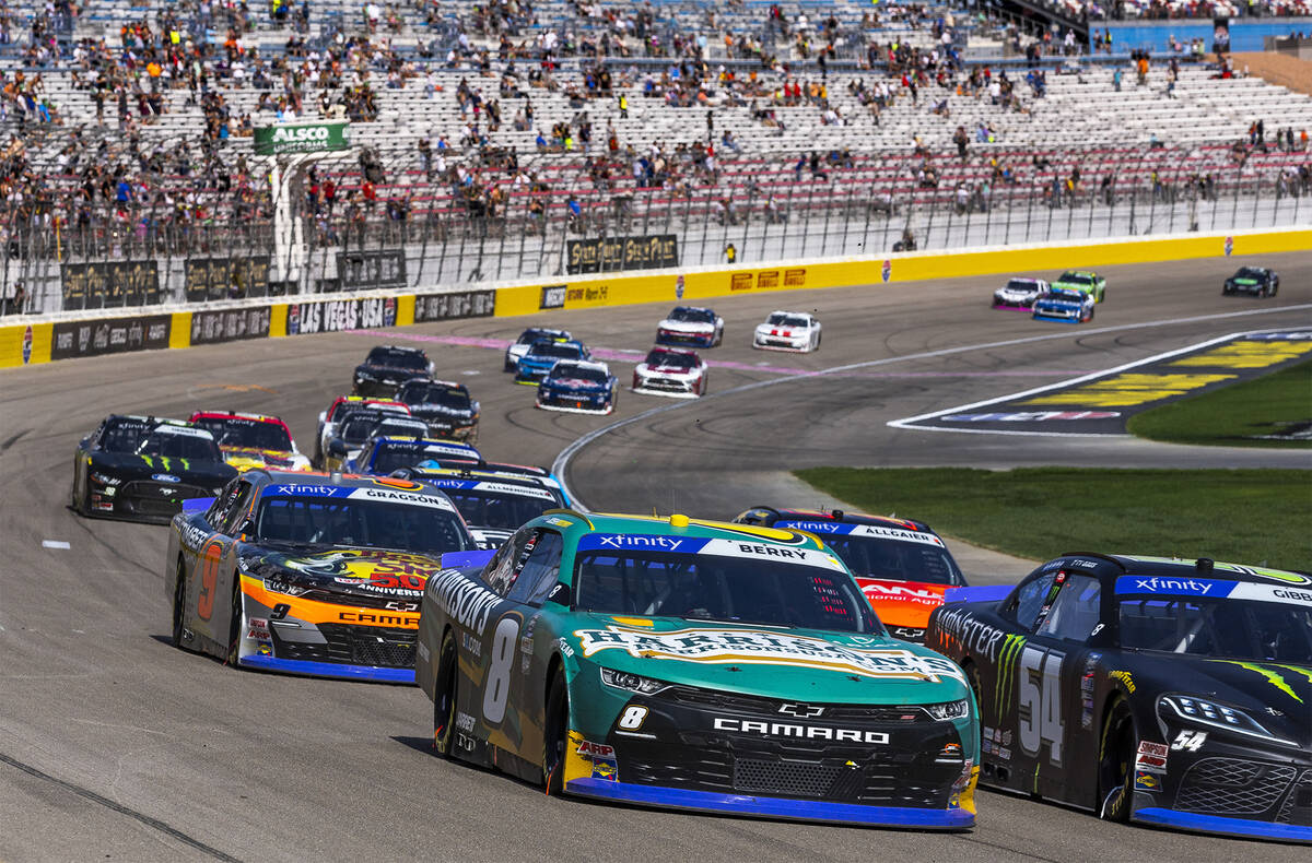 Josh Berry (8) races beside Ty Gibbs (54) and ahead of Noah Gragson (9) during the Alsco Unifor ...