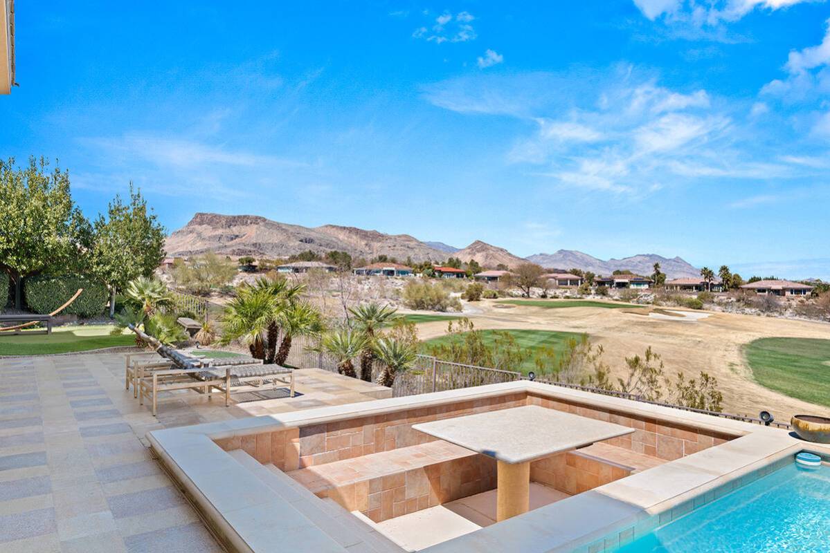 A sunken dining area near the pool. (Huntington & Ellis)