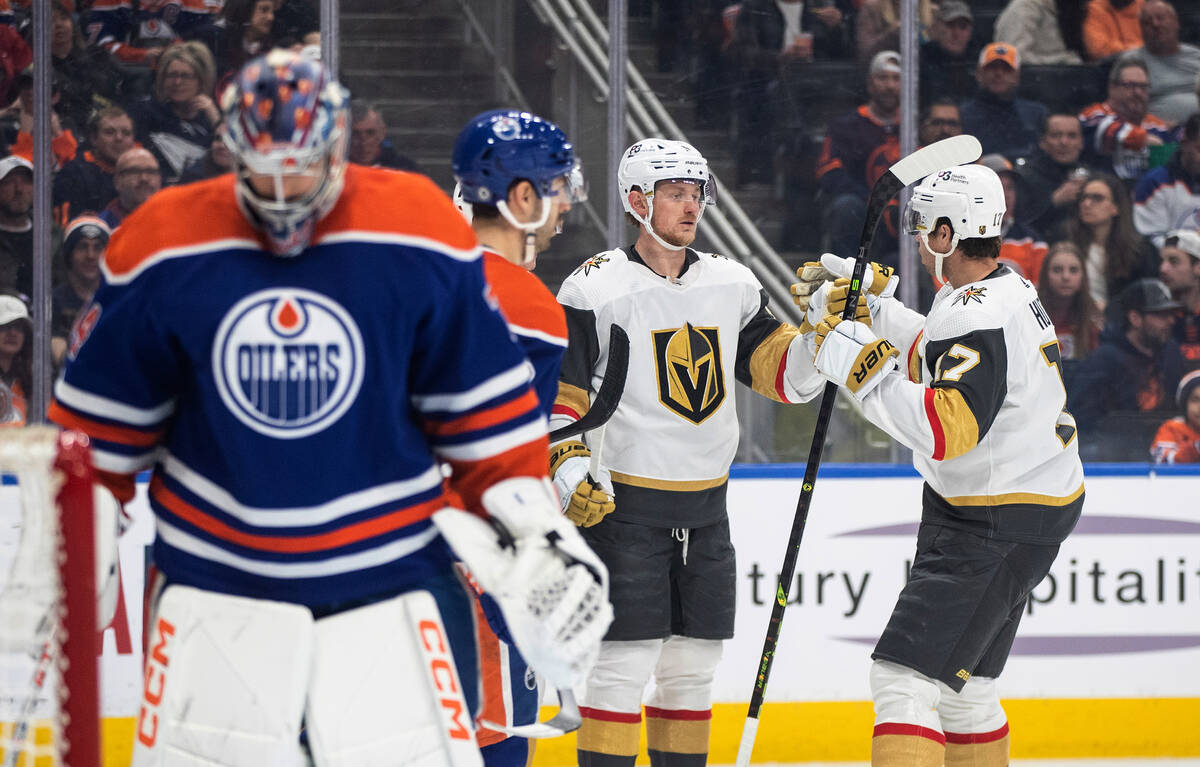 Vegas Golden Knights' Jack Eichel (9) and Ben Hutton (17) celebrate a goal on Edmonton Oilers g ...