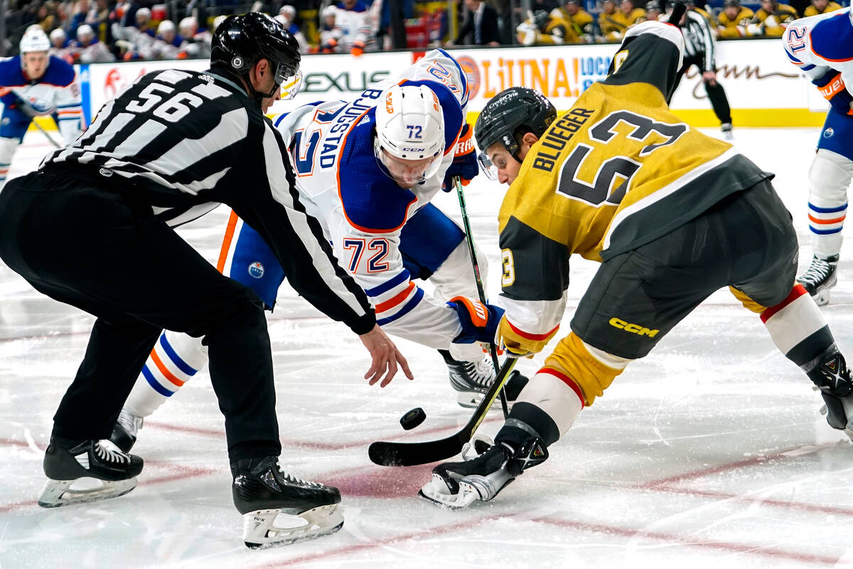 Edmonton Oilers center Nick Bjugstad (72) and Vegas Golden Knights center Teddy Blueger (53) ta ...