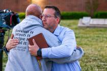 Pastor Ryan Wells hugs Nathan Brewer, the father of Brittany Brewer who was found dead, after a ...