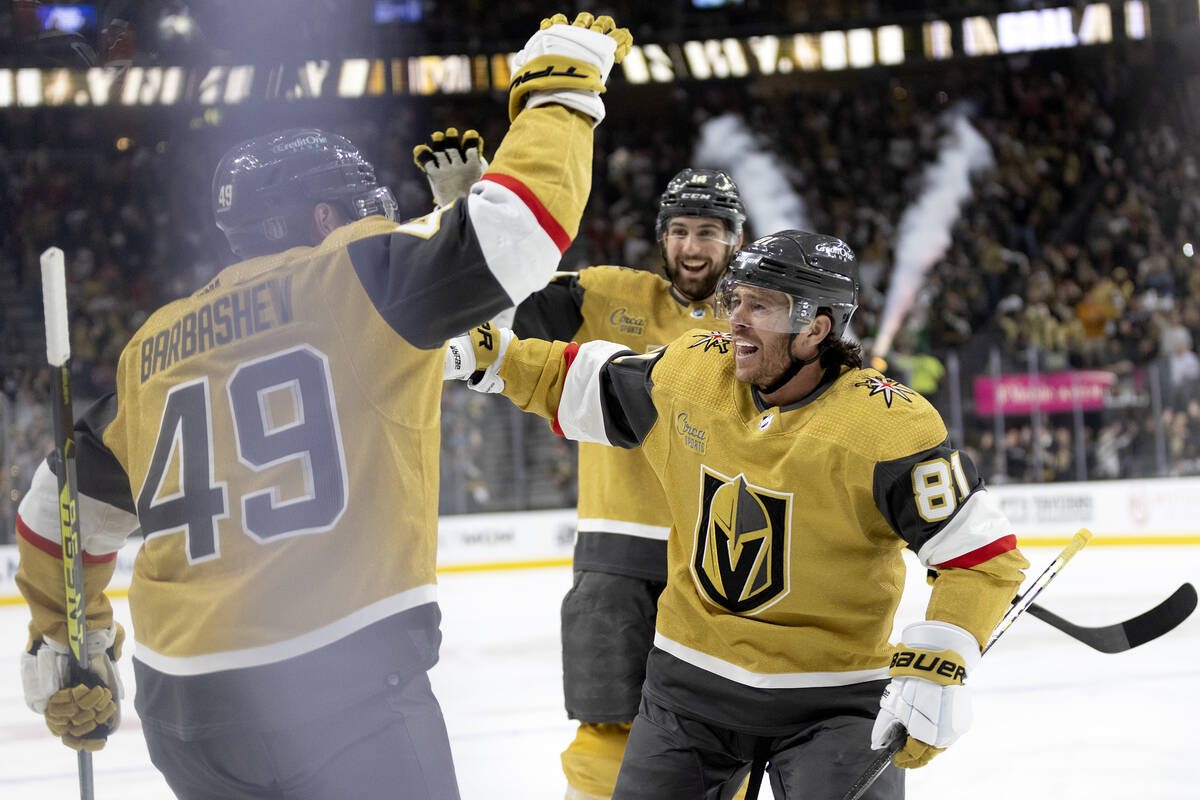 Golden Knights right wing Jonathan Marchessault (81) and defenseman Nicolas Hague, behind cente ...