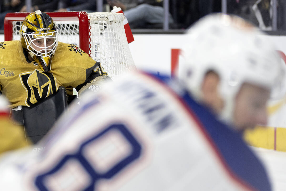 Golden Knights goaltender Laurent Brossoit (39) watches while Edmonton Oilers left wing Zach Hy ...