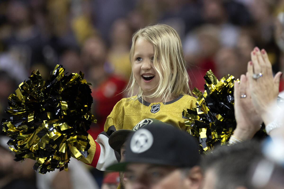 A young Golden Knights fan celebrates after her team scored during the third period in Game 1 o ...