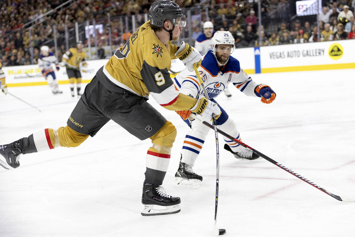 Golden Knights center Jack Eichel (9) shoots against Edmonton Oilers defenseman Darnell Nurse ( ...