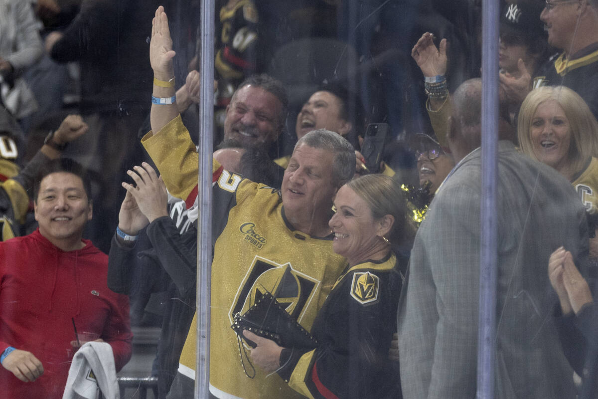 Hotel-casino owner Derek Stevens, center left, celebrates after the Golden Knights scored durin ...