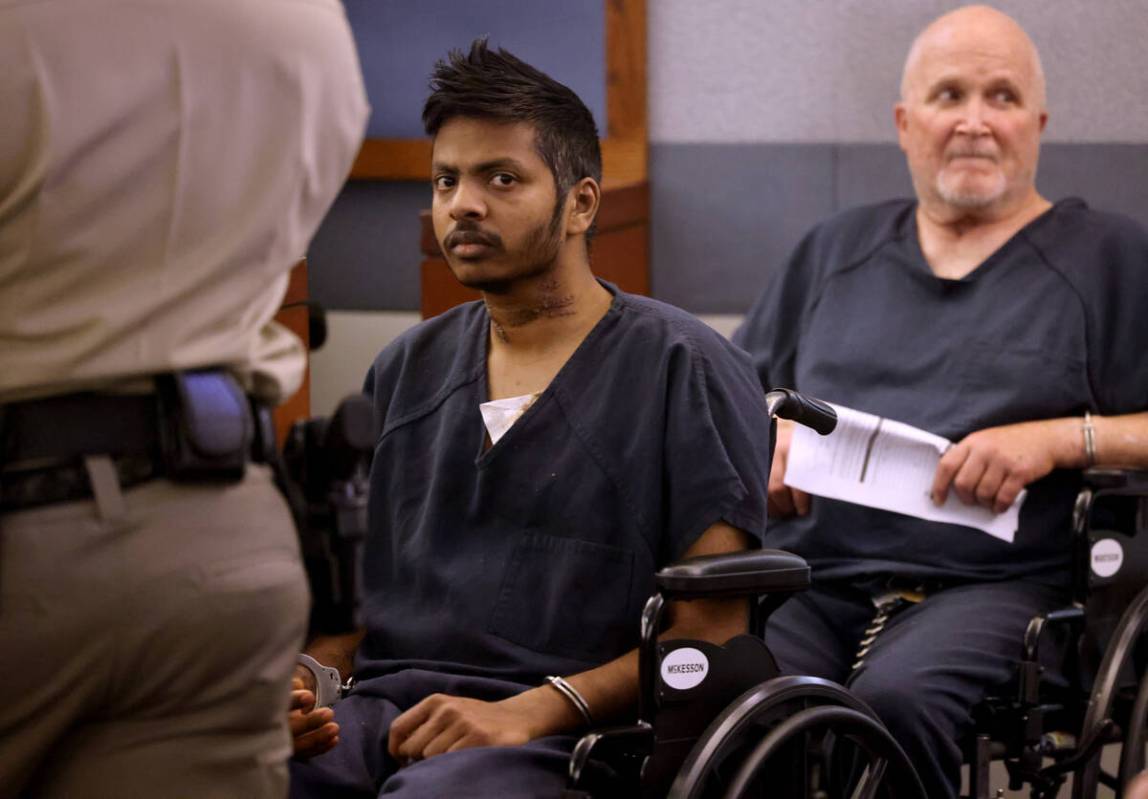 Shiva Gummi, left, accused of murdering his wife, Dr. Gwendoline Amsrala, appears in court at t ...