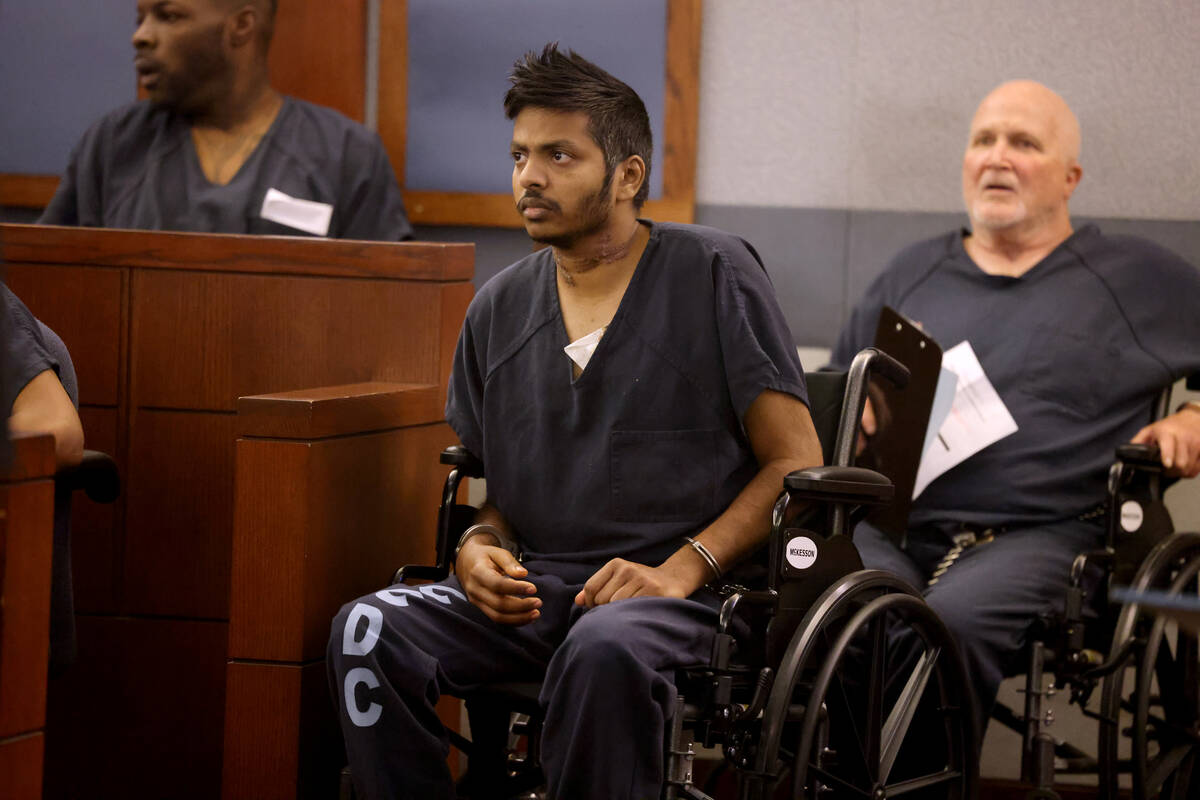 Shiva Gummi, center, accused of murdering his wife, Dr. Gwendoline Amsrala, appears in court at ...