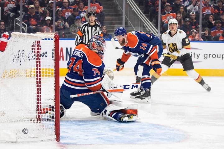 Vegas Golden Knights' Jack Eichel (9) scores on Edmonton Oilers goalie Stuart Skinner (74) as M ...