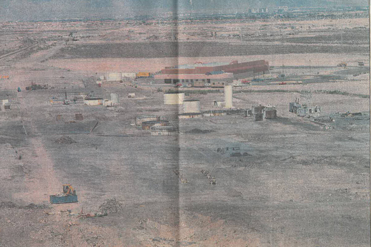 Scars on the desert landscape mark what remains of the Pacific Engineering plant on April 29, 1 ...