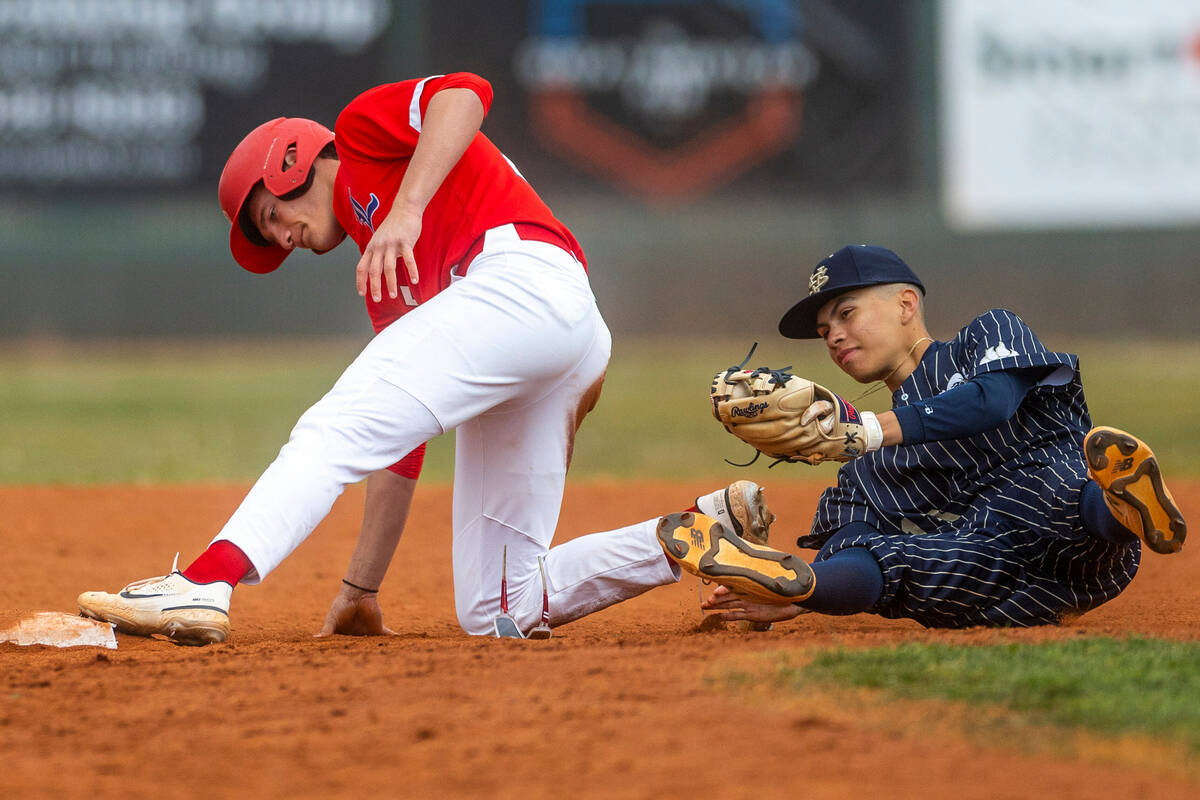 Liberty runner Dominick Rush tags safely as Spring Valley second baseman Eddy Zurita stumbles o ...