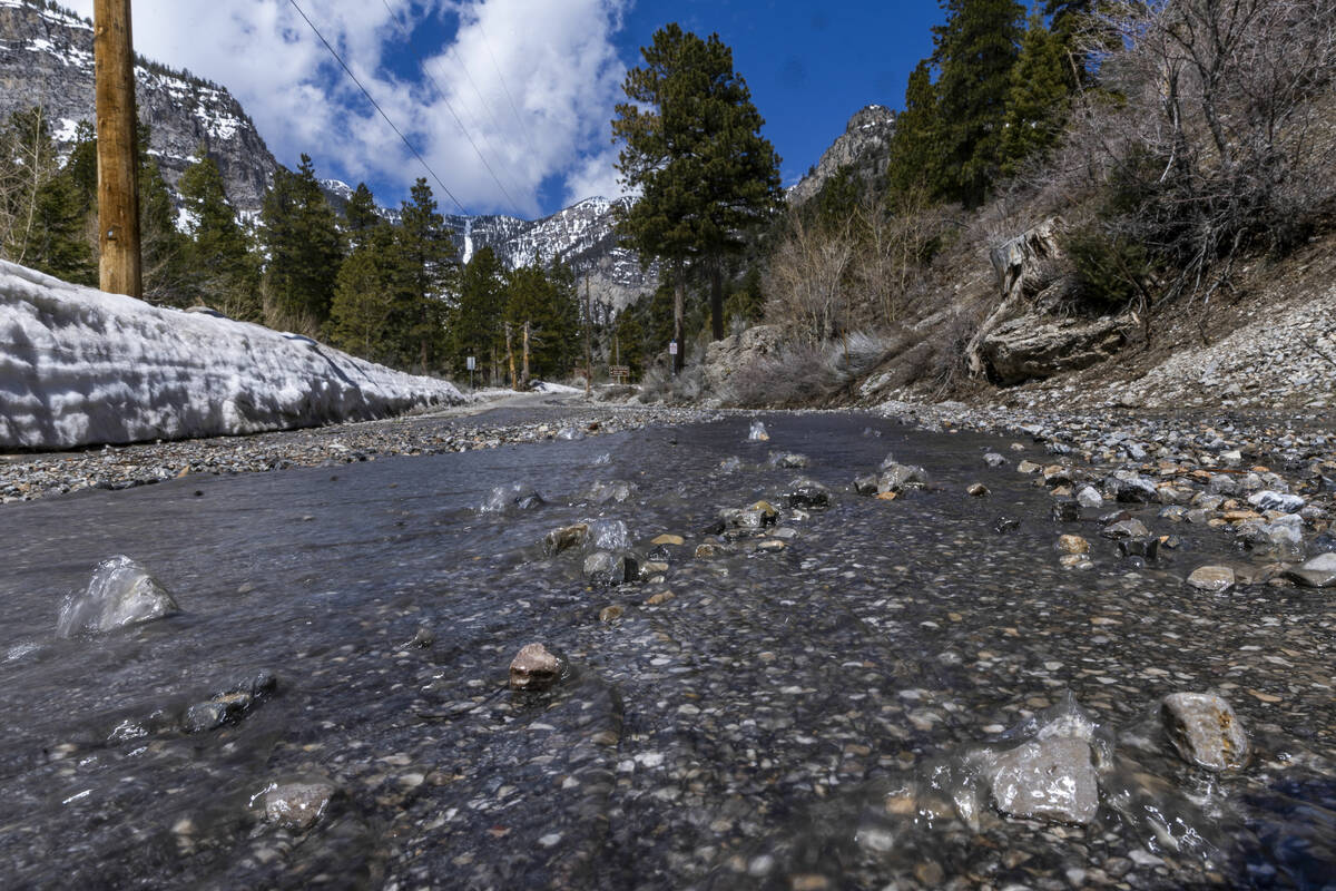 Snowmelt and smaller rocks move down Echo Road within Kyle Canyon on Mount Charleston on April ...