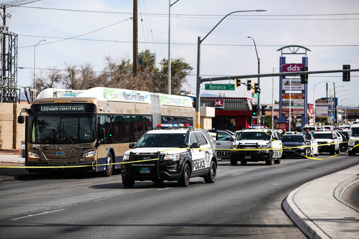 Police at the scene where at least one person was injured after a shooting in central Las Vegas ...