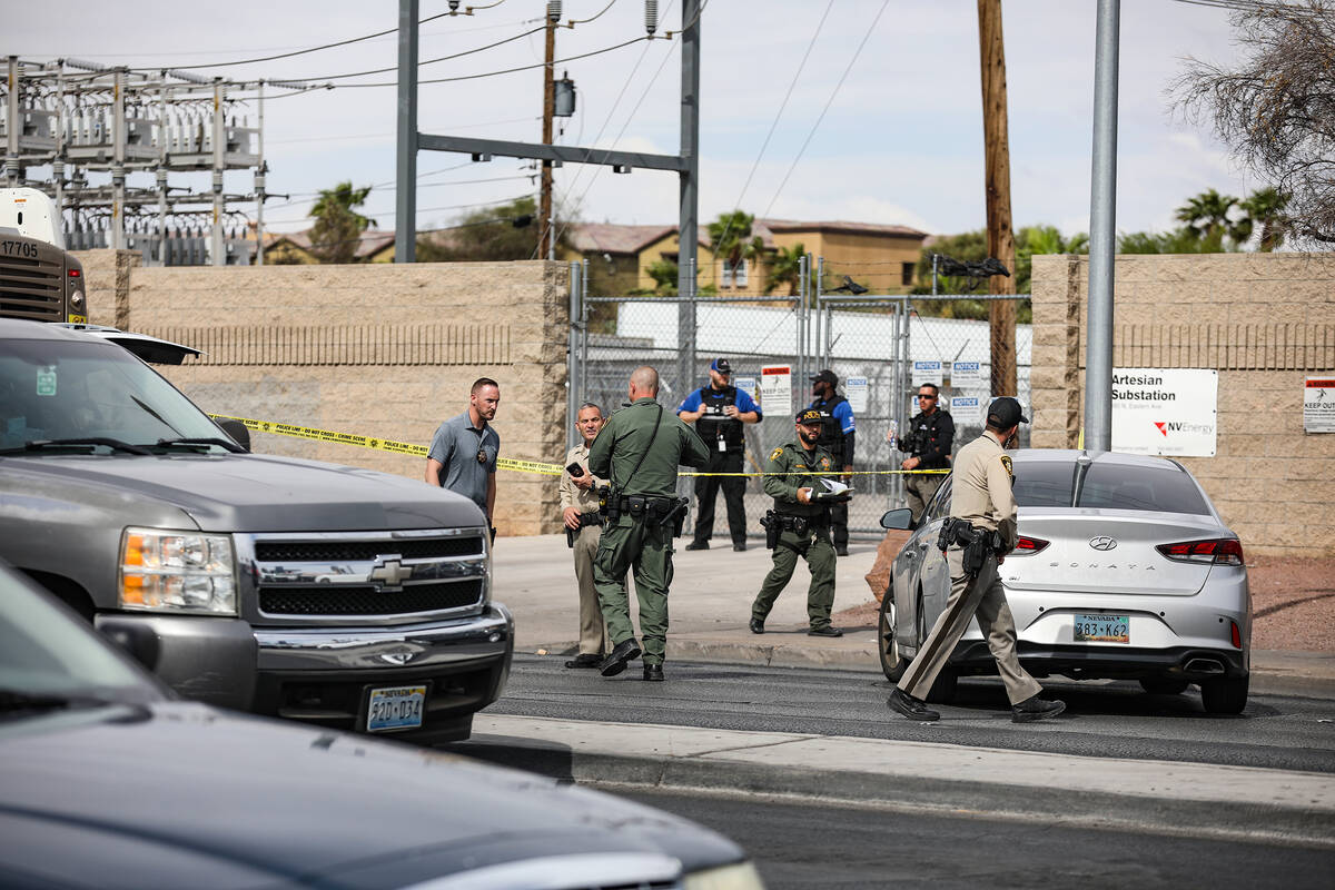 Police at the scene where at least one person was injured after a shooting in central Las Vegas ...