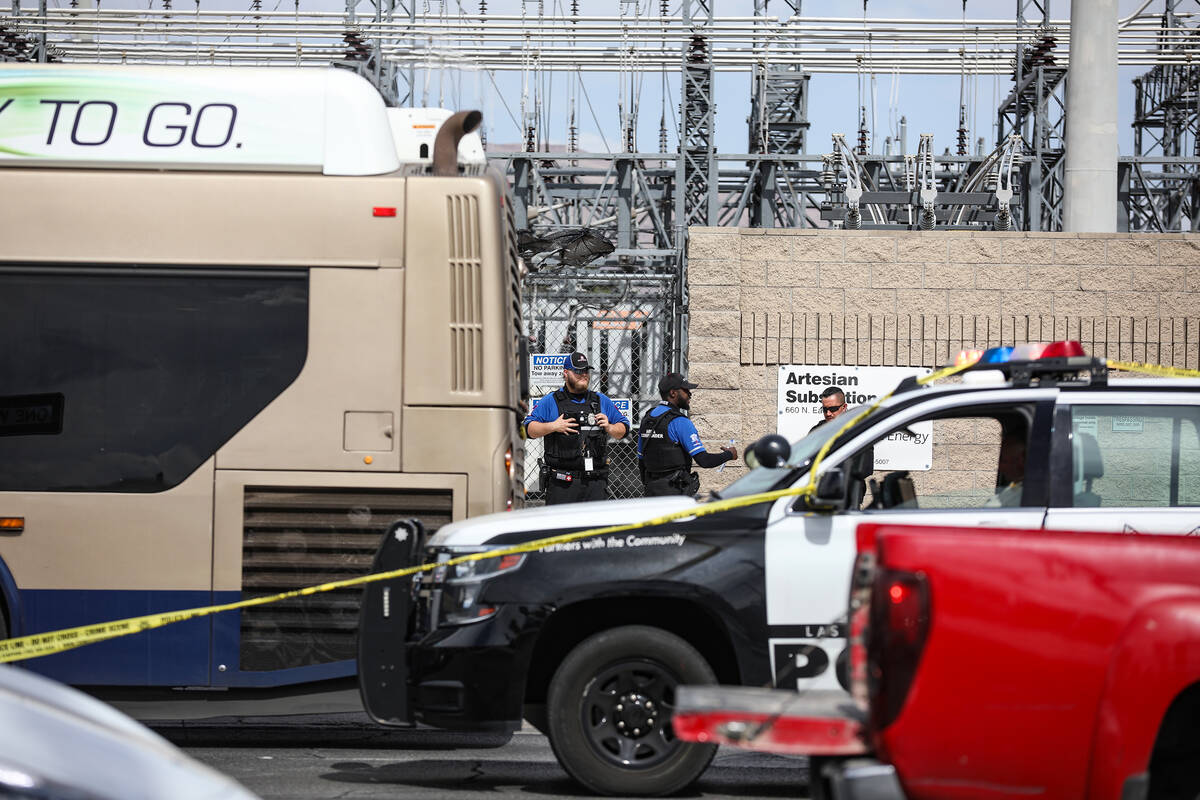 Police at the scene where at least one person was injured after a shooting in central Las Vegas ...