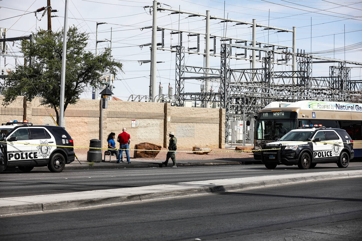 Police at the scene where at least one person was injured after a shooting in central Las Vegas ...