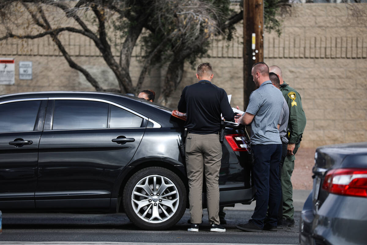 Police at the scene where at least one person was injured after a shooting in central Las Vegas ...