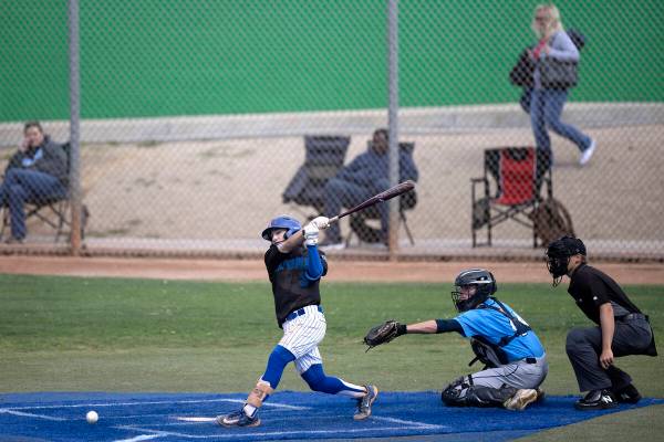 Green Valley shortstop Jacob Ferry bats against Centennial during a high school baseball game a ...