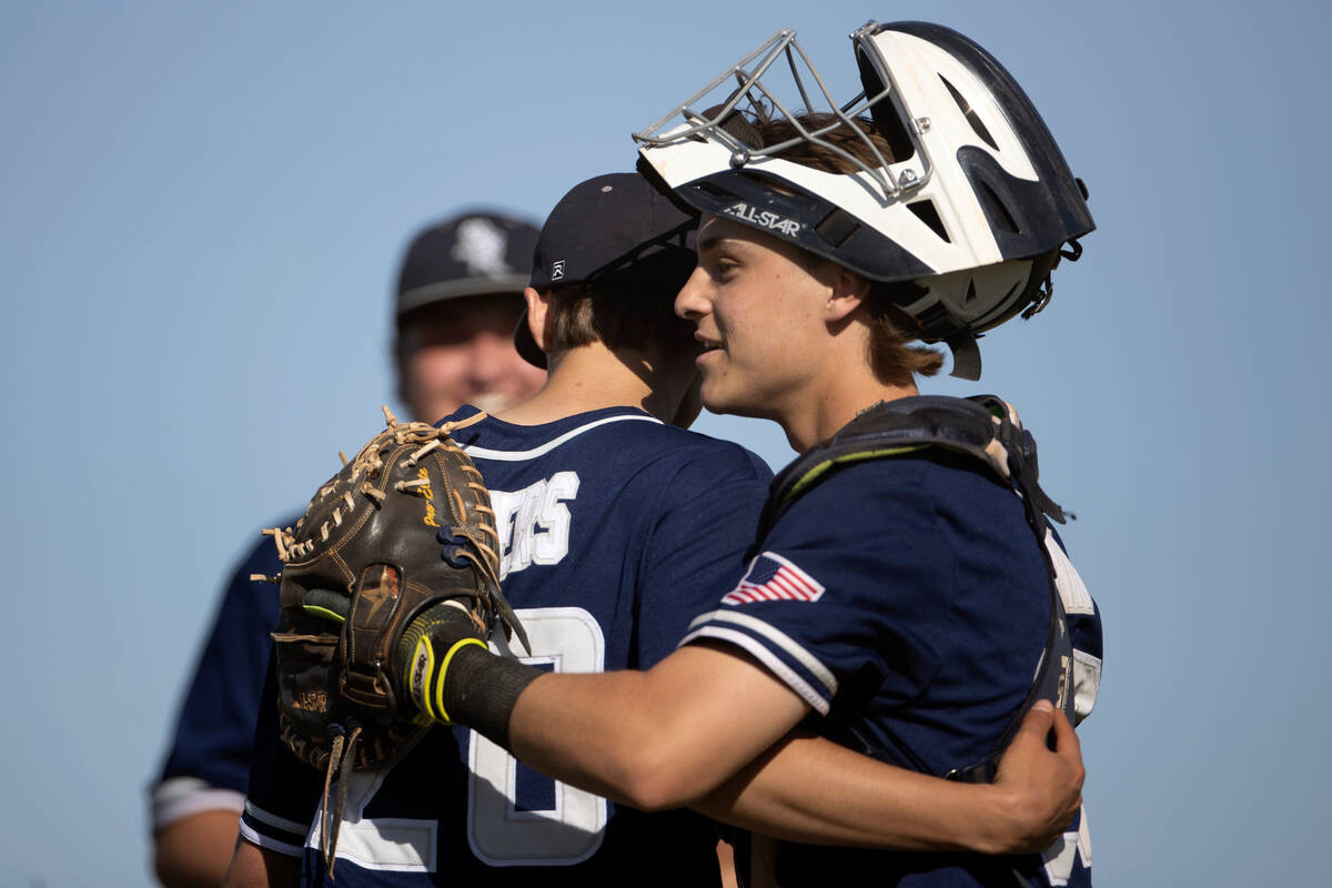 Shadow Ridge catcher Austin Lynn hugs pitcher Brayden Somers (20) after he pitched a fast innin ...