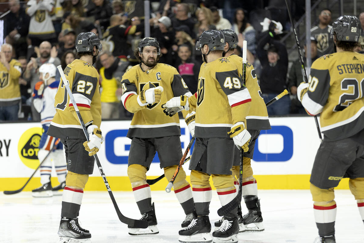 The Golden Knights celebrate after center Ivan Barbashev (49) scored during the third period in ...