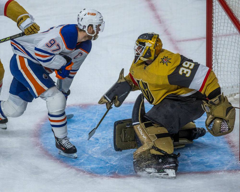 Edmonton Oilers center Connor McDavid (97) scores on Golden Knights goaltender Laurent Brossoit ...