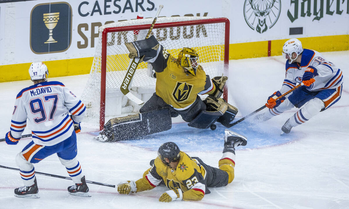 Golden Knights goaltender Laurent Brossoit (39) stops a shot from Edmonton Oilers left wing Zac ...