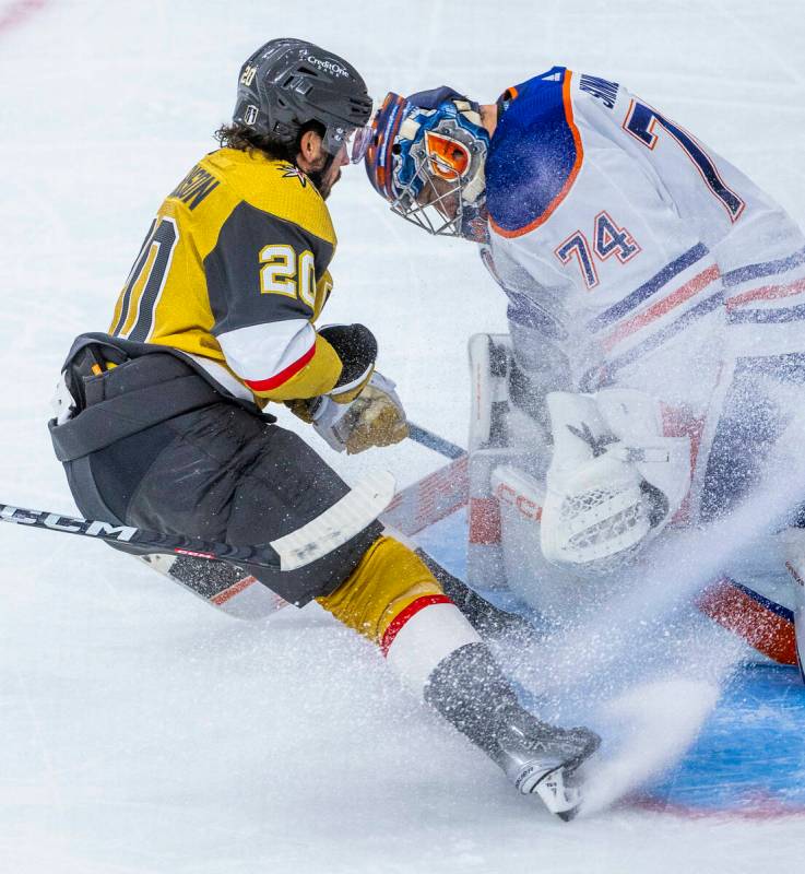 Golden Knights center Chandler Stephenson (20) attempts a shot on Edmonton Oilers goaltender St ...