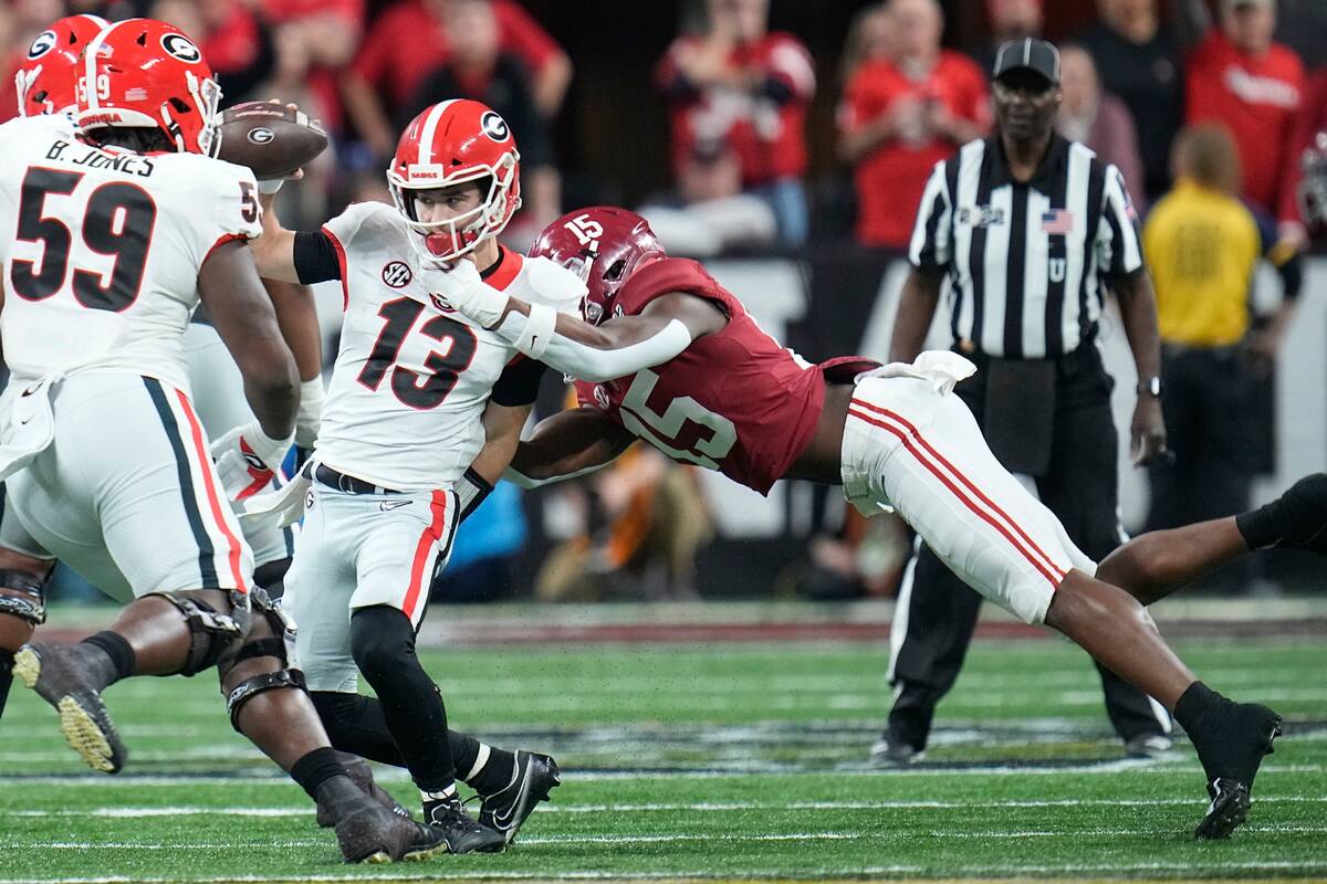 Alabama's Dallas Turner sacks Georgia's Stetson Bennett during the first half of the College Fo ...