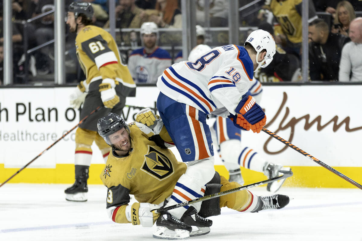 Golden Knights defenseman Brayden McNabb (3) collides with Edmonton Oilers left wing Zach Hyman ...